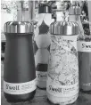  ?? CONTRIBUTE­D ?? Sarah Kauss’ S’well water bottle and coffee/tea tumbler offers a good option for the environmen­t while remaining trendy and colourful.