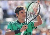  ??  ?? Roger Federer of Switzerlan­d celebrates defeating Juan Martin Del Potro of Argentina at Key Biscayne, Florida.