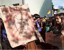  ?? AFP ?? In trouble: Protestors hold posters against AfD leader Bjoern Hoecke at the regional court in Halle, Germany on Thursday.