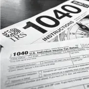  ?? Keith Srakocic/associated Press ?? Unlike a deduction, which decreases the income on which is taxed, a tax credit reduces the overall tax due, adding to a person’s refund.