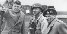  ?? STF / AFP / Getty Images ?? Gen. Dwight D. Eisenhower, left, confers with Britain’s Field Marshal Bernard Montgomery, right, on D-Day invasion plans.