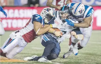  ?? GRAHAM HUGHES/THE CANADIAN PRESS ?? Alouettes defensive end John Bowman, left, says he was trying to help his teammates be “profession­als” when he criticized the team’s performanc­e after a blowout loss to Calgary.