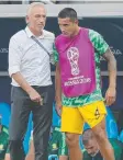  ??  ?? Coach Bert van Marwijk with Tim Cahill in the final game.