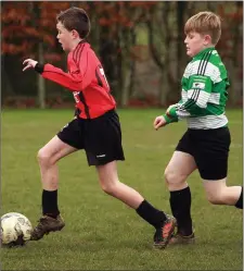  ??  ?? Darragh Gethings (Gorey Rangers) evades Jack Smyth (Gorey Celtic).