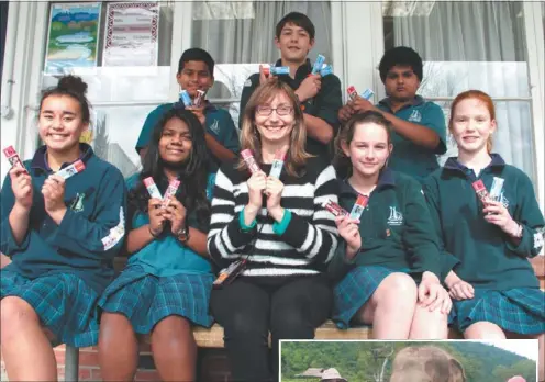  ??  ?? Selling chocolate: Seven of Ms Hand’s pupils at Blockhouse Bay Intermedia­te are volunteeri­ng their time to raise money for Thai elephants.