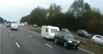  ??  ?? Terror: The 4x4 drove five miles on M40. Below, emergency services at scene