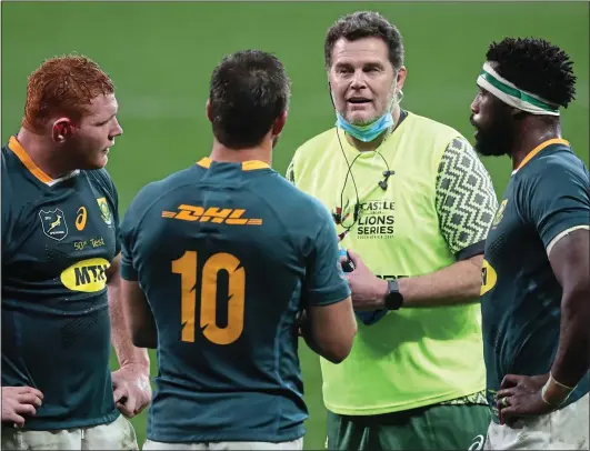  ??  ?? OUT OF ORDER: Erasmus comes on the pitch — minus water bottle — and speaks with South Africa’s Steven Kitshoff, Handre Pollard and Siya Kolisi