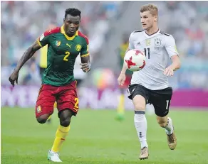  ?? — AP ?? Germany’s Timo Werner, right, and Cameroon’s Ernest Mabouka go for the ball during the Confederat­ions Cup Sunday.