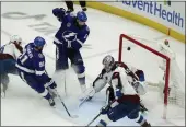  ?? CHRIS O'MEARA — THE ASSOCIATED PRESS ?? Tampa Bay Lightning left wing Pat Maroon (14) scores past Colorado Avalanche goaltender Darcy Kuemper during the second period of Game 3 of the Stanley Cup Final on Monday.