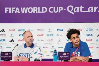  ?? Ashley Landis/Associated Press ?? U.S. head coach Gregg Berhalter and captain Tyler Adams face the media in Doha on Monday.