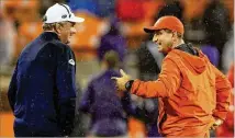  ?? STREETER LECKA / GETTY IMAGES ?? Georgia Tech coach Paul Johnson (left) and Clemson counterpar­t Dabo Swinney agree the December window offers a chance to see who’s really committed — and who’s not.
