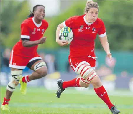  ??  ?? Captain Kelly Russell, right, and her teammates will battle Australia for fifth place on Saturday after crushing Wales Tuesday.