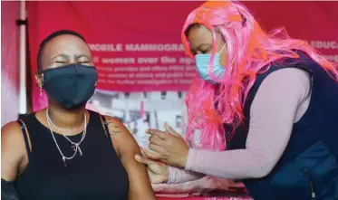  ?? | ARMAND HOUGH African News Agency (ANA) ?? NOLLY Nyama gets her vaccinatio­n. NGOs Sweat, Sisonke and Asijiki hosted Sex Worker Pride 2021 with a march,
