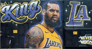  ?? AFP ?? A mural of LeBron James in a Los Angeles Lakers jersey is viewed in Venice, California. Lakers president Earvin ‘Magic’ Johnson called it a huge step for the team. —