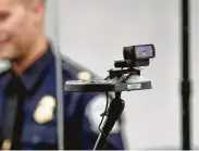  ?? John Raoux / Associated Press ?? A face recognitio­n camera scans passengers at the customs entry at Orlando Internatio­nal Airport.