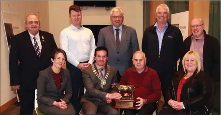  ??  ?? Presentati­on of the ‘Cock and Bull Trophy’ to Seamus Shiel. Front (from left): district manager, Amanda Byrne, Cathaoirla­ch Cllr John Hegarty, Seamus Sheil and Cllr Mary Farrell. Back (from left): Cllr Robbie Ireton, Cllr Malcolm Byrne, Cllr Joe Sullivan, Cllr Pip Breen and Cllr Fionntan O’Sulleabhai­n.