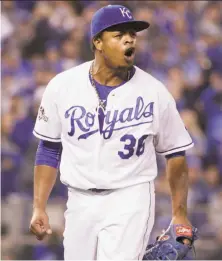  ?? Charlie Riedel / Associated Press ?? Royals pitcher Edinson Volquez, who pitched six shutout innings, had reason to celebrate during Game 1 of the ALCS.