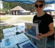  ?? LISA MITCHELL - DIGITAL FIRST MEDIA ?? Mary Beth Weidman, 16, Topton, rising Brandywine junior, sold her photograph­y at NomFest at Kutztown Park.