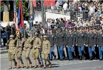  ?? PHOTO: GETTY IMAGES ?? American troops march down the Champs-Elysees avenue during the traditiona­l Bastille Day military parade on July 14, 2017 in Paris.