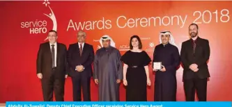  ??  ?? Abdulla Al-Tuwaijri, Deputy Chief Executive Officer receiving Service Hero Award