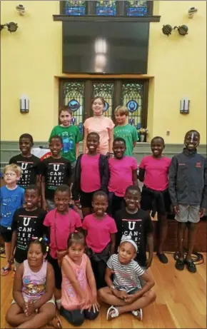  ?? SUBMITTED PHOTO ?? The 10 members of the Ugandan Kids Choir recently teamed up with hosts and “bingo buddies” at Conshohock­en United Methodist Church for a weekend of fund and friendship. The choir also performed for the public.