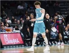  ?? JACOB KUPFERMAN — THE ASSOCIATED PRESS ?? Hornets guard Lamelo Ball walks off the court after being shaken up on a play during the second half of Monday’s game against the Pistons in Charlotte, N.C.