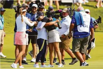  ?? Elsa / Getty Images ?? In Gee Chun of South Korea celebrates on the 18th green after capturing the Women’s PGA Championsh­ip at Congressio­nal Country Club in Bethesda, Md. It was her third major title.