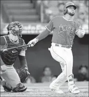  ?? John McCoy Getty Images ?? THE ANGELS’ Francisco Arcia and Seattle catcher Mike Zunino watch Arcia’s homer in the third.