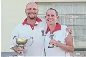  ?? ?? CUP WINNERS: Ryan Cup winner Hein Strombeck, left, and runner-up Joanne van Rensburg with their trophies. Hein beat Joanne 21-11 in the final.