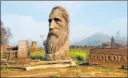  ?? Brian Melley The Associated Press ?? A wood-carved statue of naturalist and Sierra Club founder John Muir stands next to the road leading to Sequoia National Park near Woodlake, Calif.