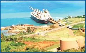  ??  ?? A bauxite carrying ship docks at Port Rhoades, Discovery Bay. Noranda mines and exports bauxite and is a major contributo­r to Jamaica’s economic and social developmen­t, pumping some US$80 million per year into the economy