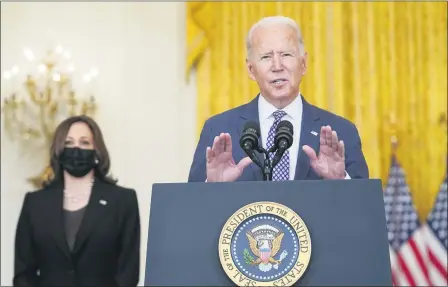  ?? MANUEL BALCE CENETA — THE ASSOCIATED PRESS ?? President Joe Biden speaks about the evacuation of American citizens, their families, SIV applicants and vulnerable Afghans in the East Room of the White House, Friday, Aug. 20, in Washington. Vice President Kamala Harris listens at left.