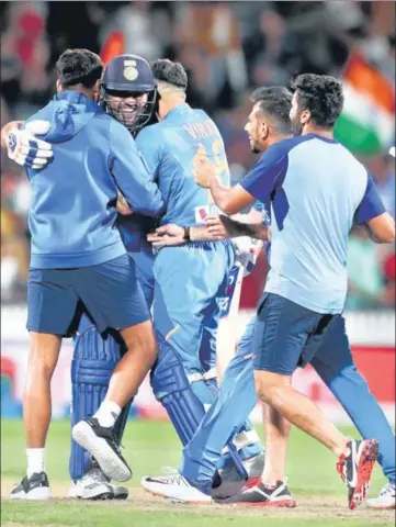  ?? AFP ?? ■
Rohit Sharma is hugged by skipper Virat Kohli after he hit two successive sixes in the Super Over to win the match for India.