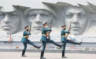  ?? Picture: Reuters ?? MASKED WARRIORS. Honour guards march near a World War II monument in Stavropol, Russia, on the anniversar­y of the beginning of the Great Patriotic War against Nazi Germany in 1941.