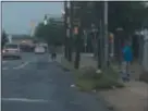  ?? L.A. PARKER — THE TRENTONIAN ?? Early September photo captured recent poop panhandler on Hamilton Ave., weeds, curb-lined garbage and another man who had urinated in public.