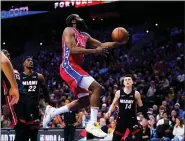  ?? MATT SLOCUM — THE ASSOCIATED PRESS ?? The Sixers’ James Harden goes up for a shot during the second half of Game 4against the Heat Sunday night at Wells Fargo Center.