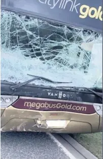  ??  ?? WRECKED Shattered glass at the front of the bus