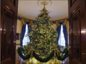  ?? CAROLYN KASTER — THE ASSOCIATED PRESS FILE ?? The official White House Christmas tree is seen in the Blue Room during the 2018 Christmas Press Preview at the White House in Washington.