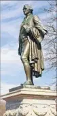  ?? Barry Winiker Getty Images ?? A STATUE of Alexander Hamilton keeps watch over the Great Falls.