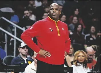  ?? AP PHOTO/JOHN BAZEMORE ?? Atlanta Hawks head coach Nate McMillan looks on from the bench during the first half of an NBA basketball game against the Phoenix Suns on Feb. 9 in Atlanta.