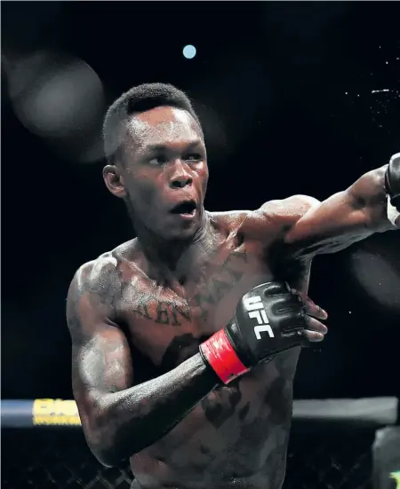  ??  ?? Israel Adesanya landed some good shots on Anderson Silva but had to be content with a unanimous decision.