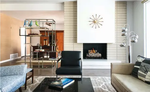  ??  ?? FOR THIS 1970s PALM SPRINGS HOME, CONTRACTOR ROGER KROST DEMOED MIRROR CLADDING THAT WAS PLACED OVER THE FIREPLACE, REHABBED ORIGINAL BRICK AND POLISHED THE ORIGINAL CARRARA MARBLE HEARTH TO BRING THE FIREPLACE BACK TO LIFE.