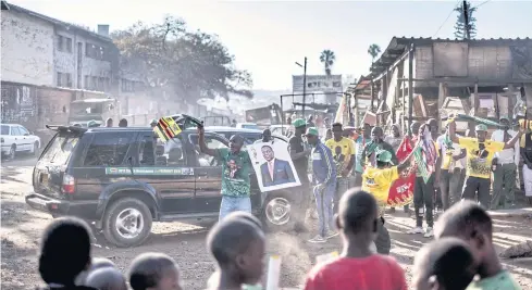  ?? AFP ?? Supporters of the newly reelected Zimbabwe President Emmerson Mnangagwa celebrate in Mbare, Harare yesterday. Emmerson Mnangagwa won 50.8% of the vote, ahead of Nelson Chamisa of the opposition MDC party on 44.3%.