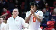  ?? (AP/Charles Rex Arbogast) ?? Illinois’ Terrence Shannon Jr. prepares to enter the game against Rutgers on Sunday as Coach Brad Underwood watches in Champaign, Ill. A federal judge reinstated Shannon, who had been suspended from the team because he was charged with rape in Kansas.