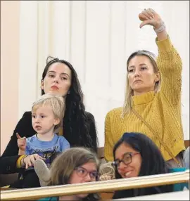  ?? Photograph­s by Rich Pedroncell­i Associated Press ?? OPPONENTS OF a plan to tighten rules for vaccine exemptions react at a hearing in Sacramento in May. The amended bill goes to an Assembly panel Thursday.