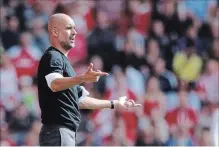 ?? ASSOCIATED PRESS FILE PHOTO ?? Manchester City head coach Pep Guardiola gestures during an English Premier League soccer match against Southampto­non Sunday.