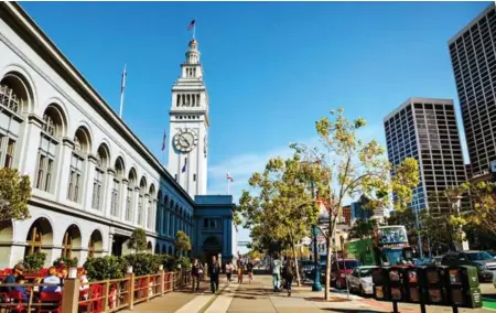  ??  ?? Just a quarter century ago, a two-level highway ran parallel to the historic ferry building in San Francisco. After the 1989 earthquake, the Embarcader­o was reimagined as a grand waterfront boulevard.