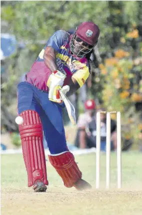  ?? (Photo: Garfield Robinson) ?? Jamaica and West Indies icon Chris Gayle bats during an exhibition game at Treasure Beach Sports Park in St Elizabeth on Sunday.