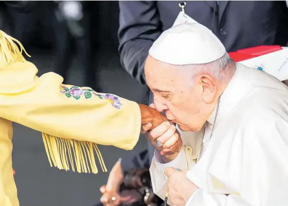  ?? Photo / AP ?? Pope France kisses the hand of Elder Alma Desjarlais of the Frog Lake First Nation and residentia­l school survivor.