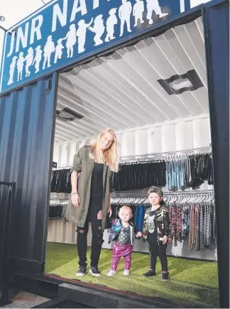  ?? Picture: RICHARD GOSLING ?? Sarah Richards, with children Carter, 3, and Halo, 11 months, has set up shop in a $2000 shipping container at the family’s mechanic workshop. MEGAN BIROT